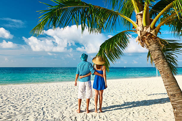 istock Couple in blue clothes on a beach at Maldives 465458288