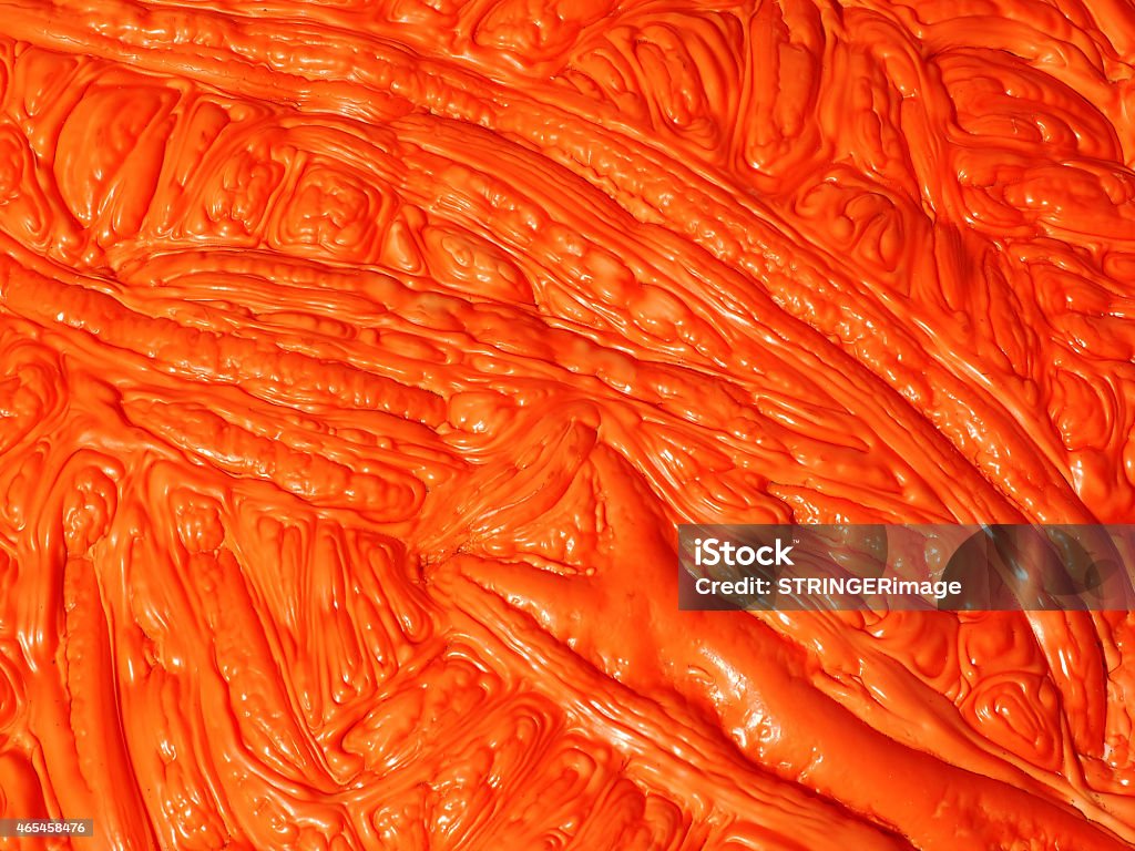 Orange polymer mass with lat wave structure in deep shades A orange polymer mass with a flat wave, dough or mud like structure in deep shades 2015 Stock Photo