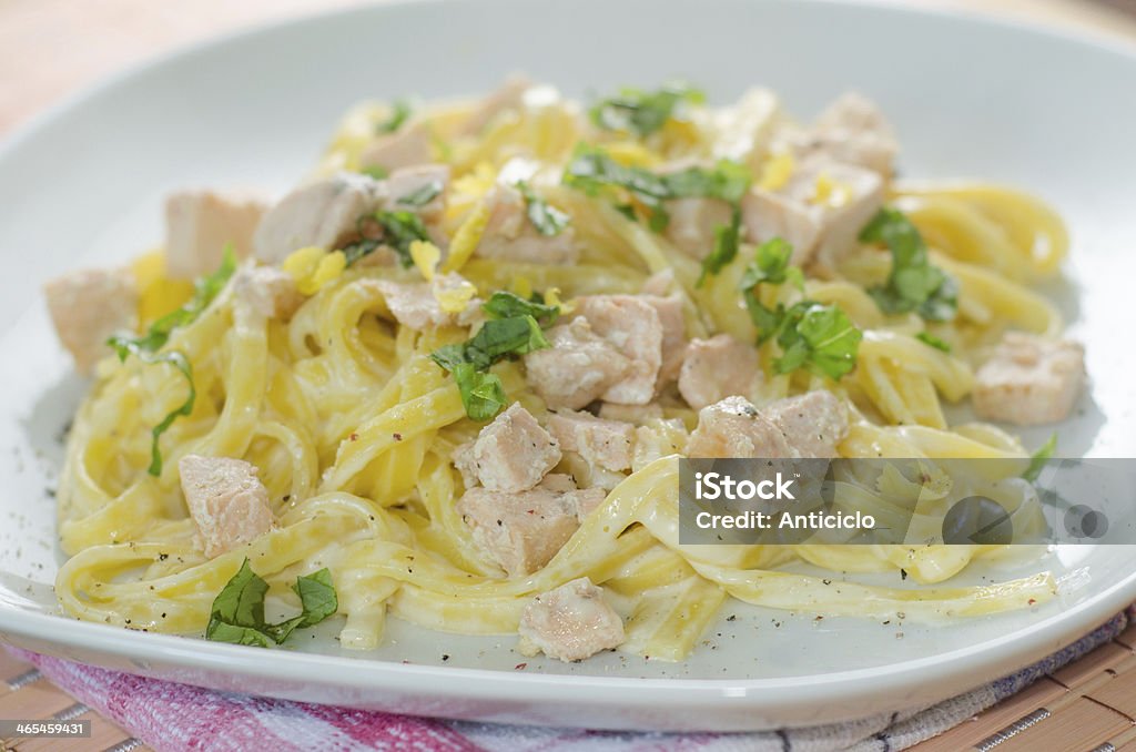 Spaghetti with salmon and herbs Close up on a dish of tagliatelle with cream and salmon Cheese Stock Photo