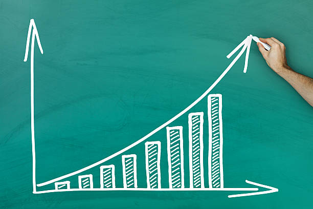 istock Hand writing on profit growth chart blackboard 465463331