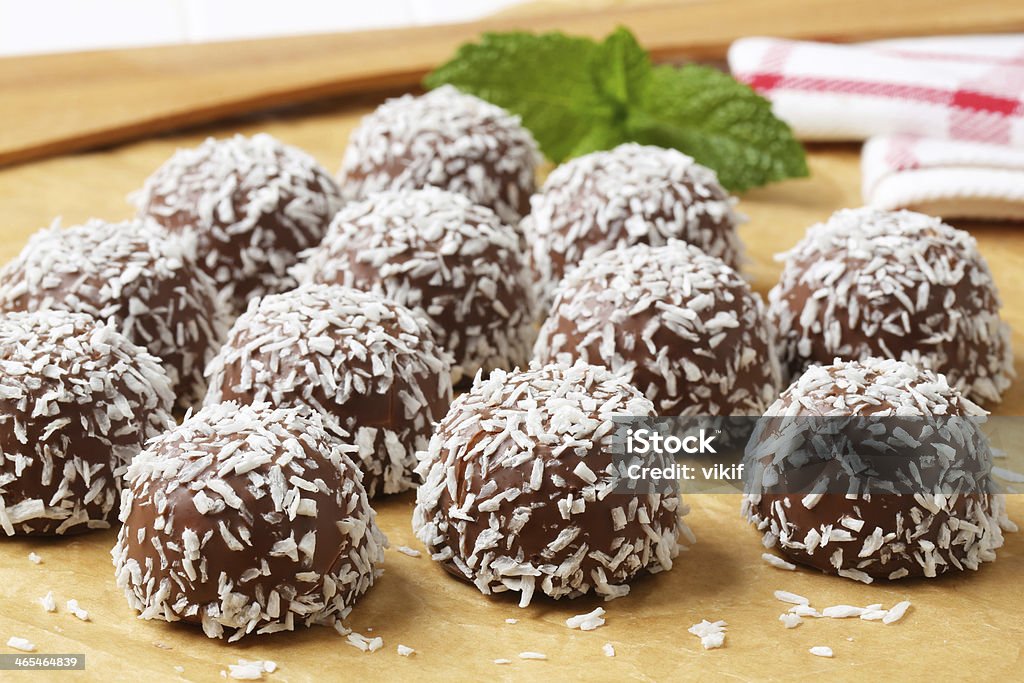 Chocolate coconut snowball cookies No-bake chocolate snowball cookies rolled in coconut Candy Stock Photo