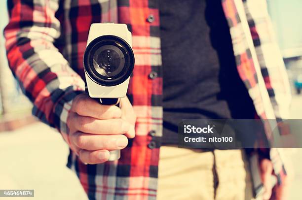 Young Man Pointing A Super 8 Camera At The Observer Stock Photo - Download Image Now
