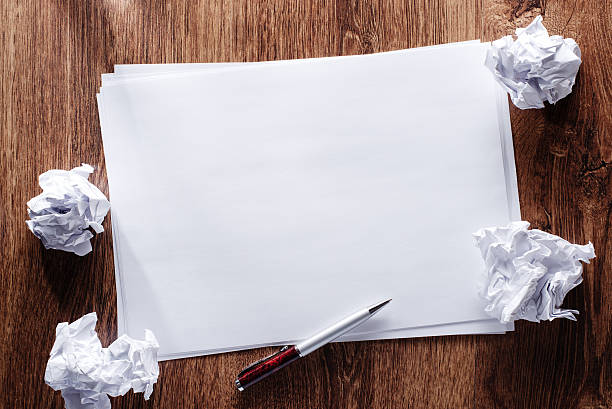 istock Blank Papers and Pen with Crumpled Papers on Sides 465465568