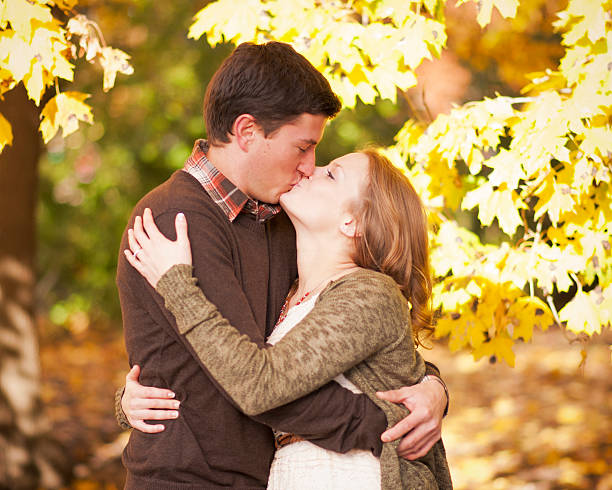 istock Young happy couple in the park 465465771