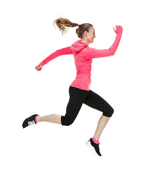 istock Smiling woman in exercise clothes and running 465466512