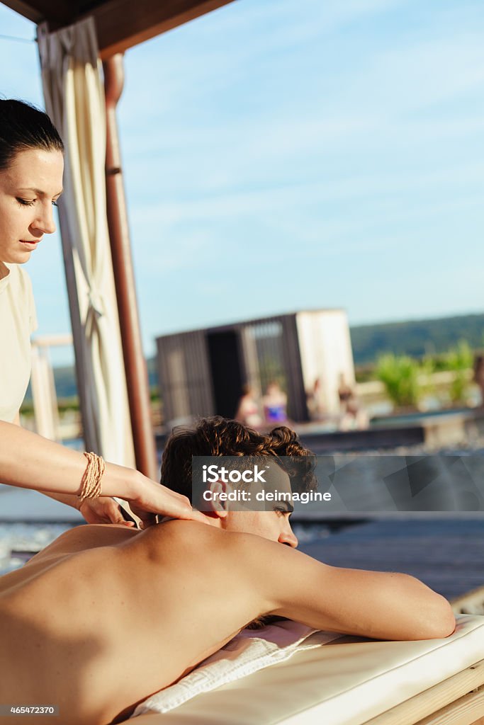 Man during a massage in the spa man during a massage in the spa. 20-24 Years Stock Photo