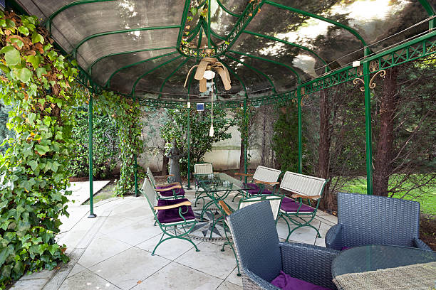 istock Gazebo in garden with table and chairs 465473370