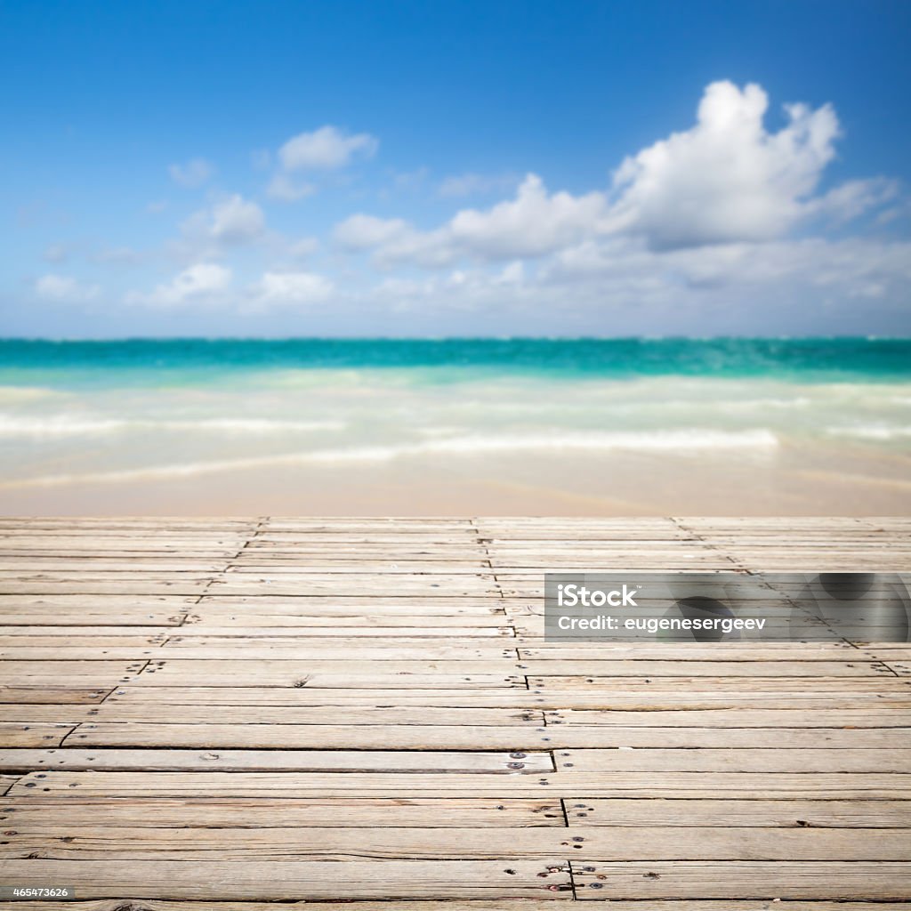 Wooden pier and blurred sea landscape on a background Square photo with empty wooden pier and blurred sea landscape on a background 2015 Stock Photo