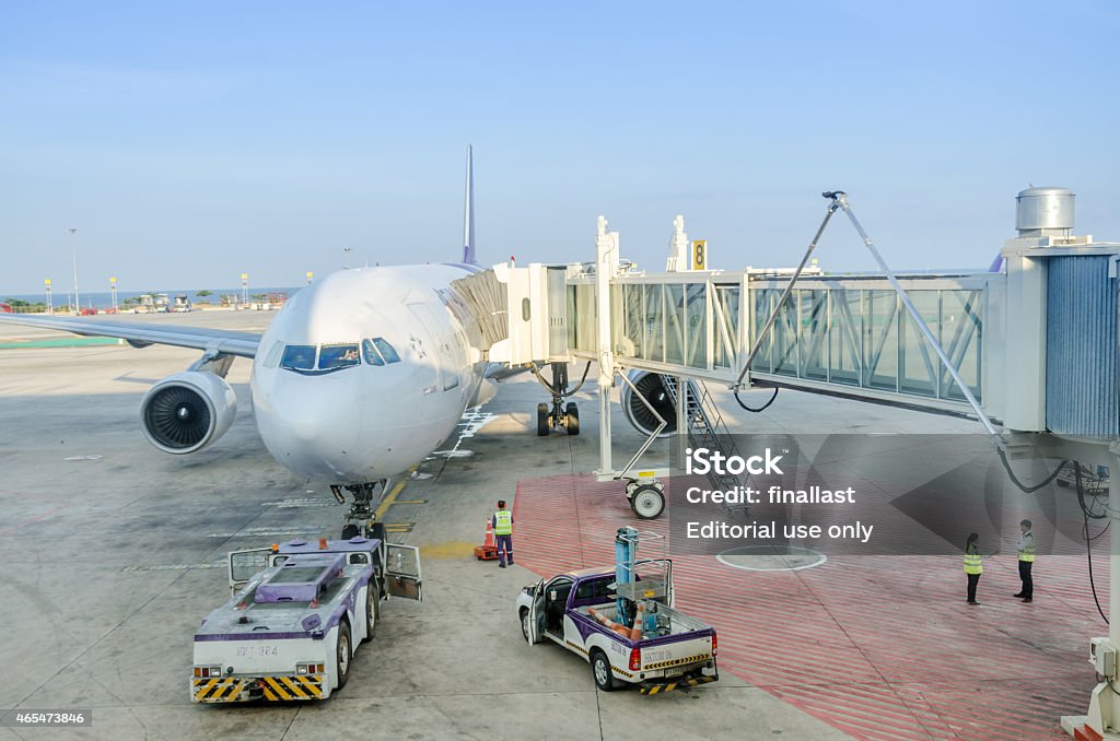 Airplanes disembarking passengers after flights Phuket, Thailand - February 27, 2015: Airplanes disembarking passengers after flights on Feb 27, 2014 in Phuket, Thailand 2015 Stock Photo