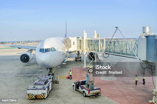 Airplanes Disembarking Passengers After Flights Stock Photo - Download Image Now - 2015, Aerospace Industry, Air Vehicle