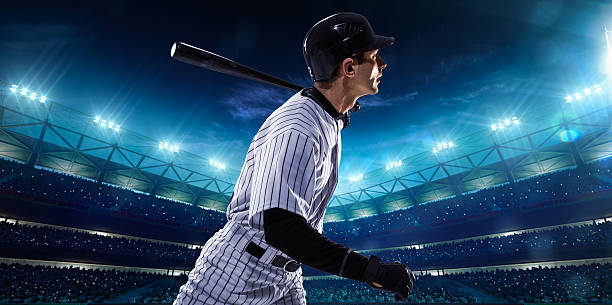 istock Professional baseball players on night grand arena 465474590