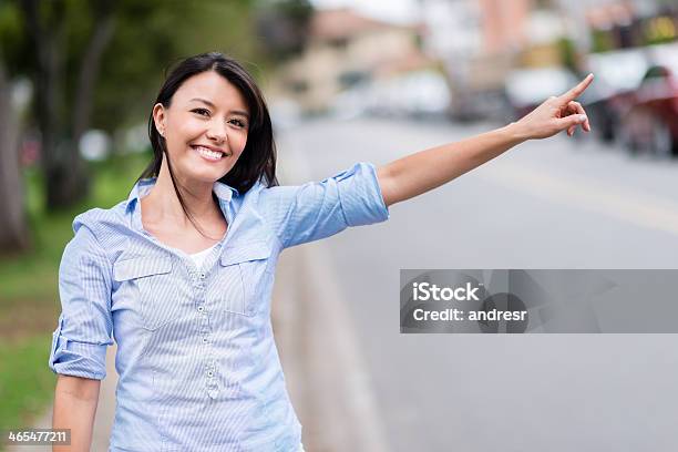 Woman Hailing A Taxi Stock Photo - Download Image Now - Adult, Adults Only, Arms Raised