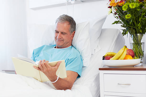 Patient Reading Reference 130+ Patient Is Lying On Bed Reading In Hospital Ward Stock Photos ...