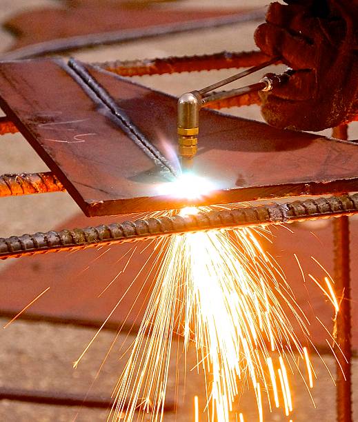 istock Oxygen and acetylene torch cutting steel with sparks 465479520
