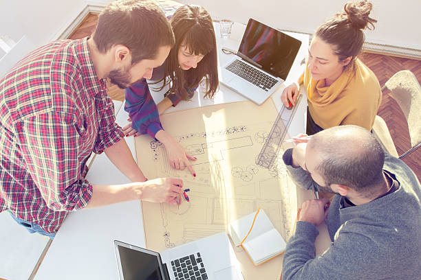 istock Young group of people discussing business plans 465480662