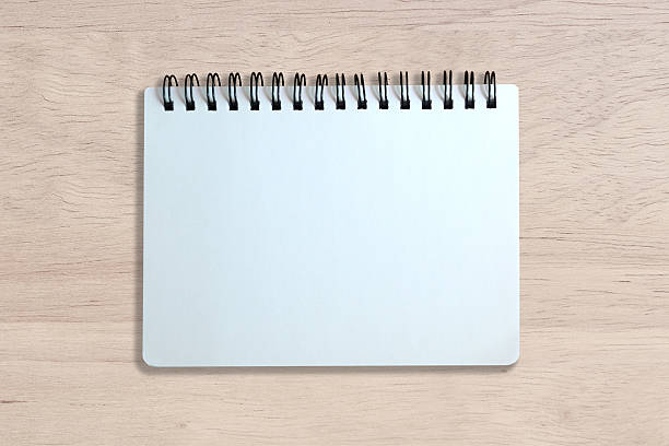 istock white page of notebook on wood texture 465480824