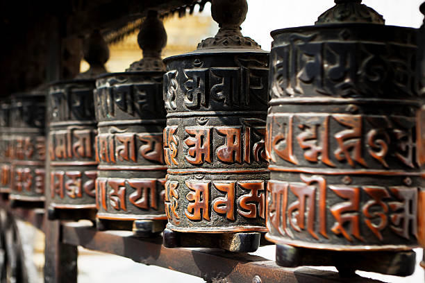 Swayambhunath temple bells in the Kathmandu valley Swayambhunath temple bells in the Kathmandu valley prayer wheel nepal kathmandu buddhism stock pictures, royalty-free photos & images