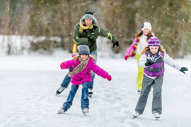 istock Family Ice-Skating on Pond 465483211
