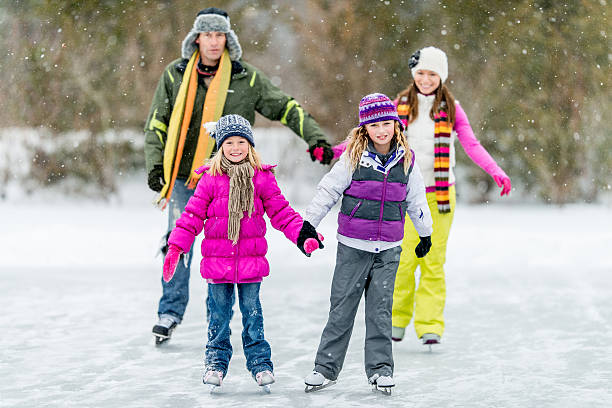 istock Family Ice-Skating on Pond 465483249