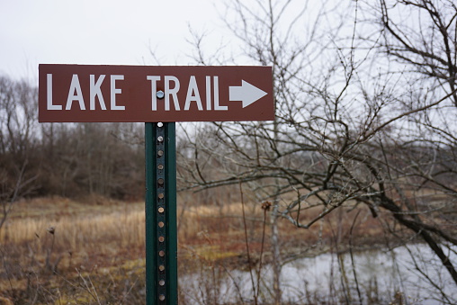 Hiking sign showing a trail that leads to a lake