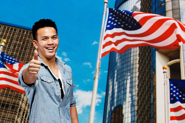 istock Smiling man giving thumbs up with American flag 465484339