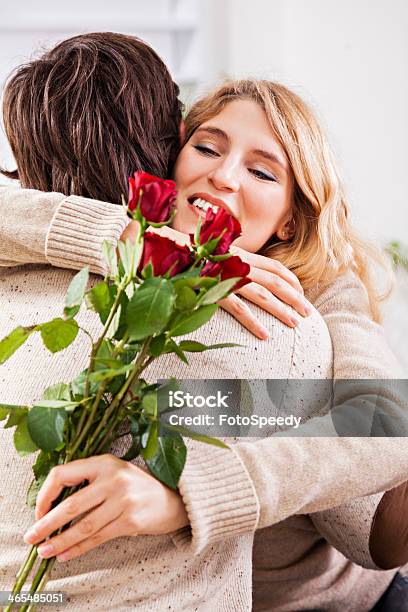 Young Man Giving A Red Rose To His Girlfriend Stock Photo - Download Image Now - Adult, Adults Only, Affectionate