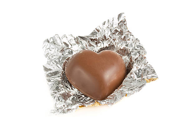 istock Heart shaped chocolate in a foil wrapper 465485494
