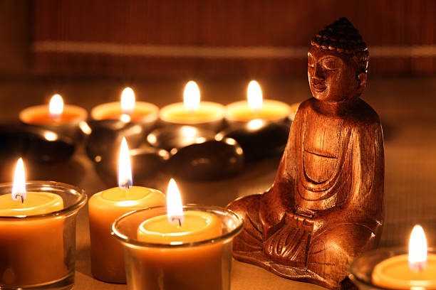 istock Zen stones with candles and a Buddha figure 465486163