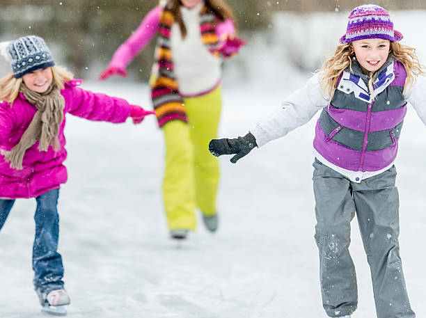istock Family Ice-Skating on Pond 465486195