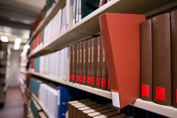 istock book popping out of a bookshelf 465486262