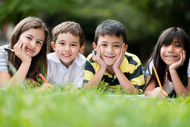 istock Group of young students outdoors 465486787