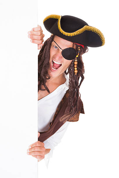 istock Young Pirate Pointing At Blank Placard 465489489