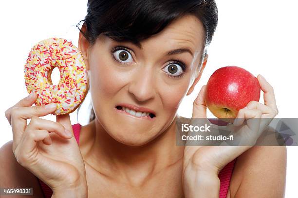 Woman Choosing Food Stock Photo - Download Image Now - Eating, Guilt, Adult