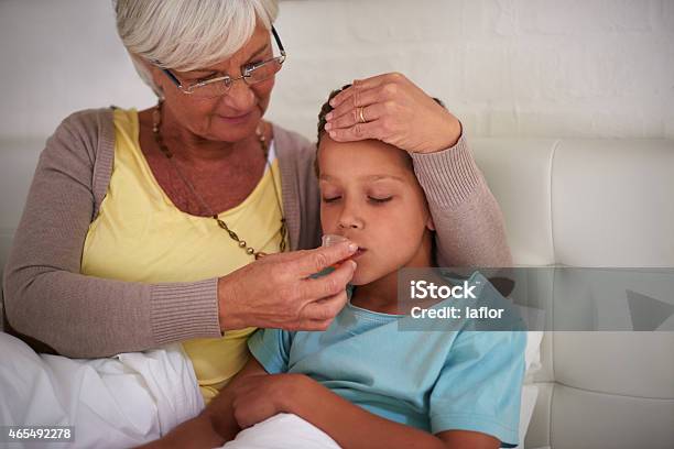 Medicine Will Help With The Sniffles Stock Photo - Download Image Now - 2015, Adult, Bed - Furniture