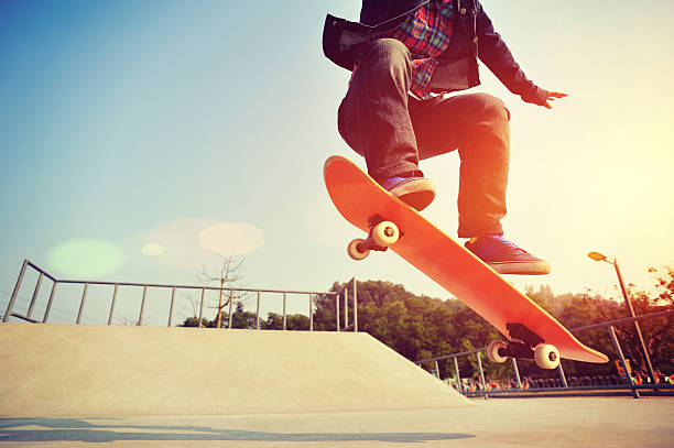 skateboarding  jumping at  sunrise skateboarding  jumping at  sunrise skatepark skateboard stock pictures, royalty-free photos & images