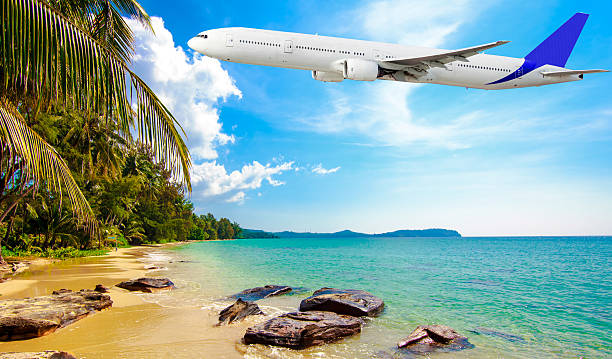 istock Jet plane over the tropical sea 465494212