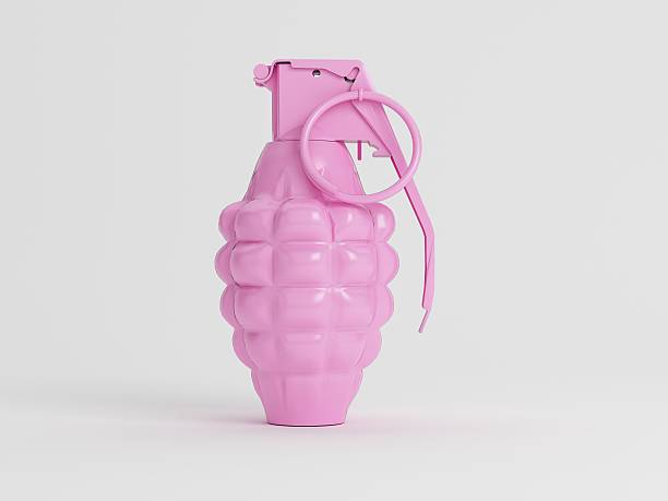 Toy Hand Granade Studio Shot a single pink toy hand granade - shot on white with a pink material hand grenade stock pictures, royalty-free photos & images