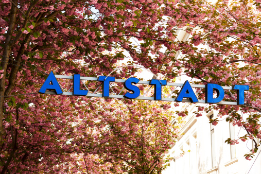 Letter and light sign Altstadt Bonn, shot in spring with blossom of trees. North Rhine Westfalia.