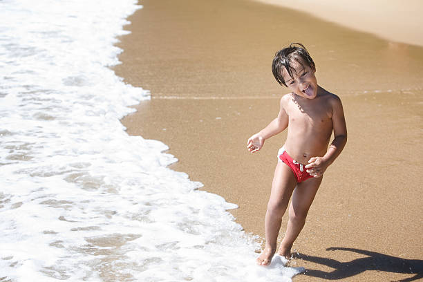 istock Four- year-old boy running on the beach. 465501054