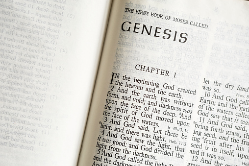 Genesis Bible Text photographed close up with copy space