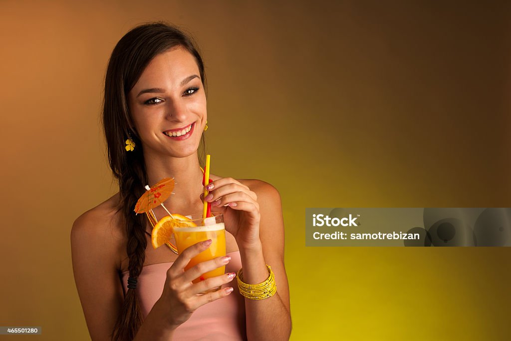 Girl drinks a cocktail in night club 2015 Stock Photo