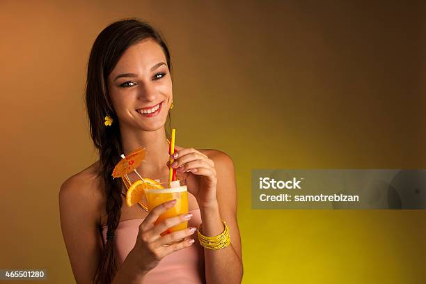 Girl Drinks A Cocktail In Night Club Stock Photo - Download Image Now - 2015, Adult, Alcohol - Drink