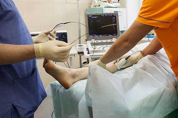 Cosmetic Surgery, varicose veins The surgeons performs the operation on the veins of cosmetology blood clot photos stock pictures, royalty-free photos & images