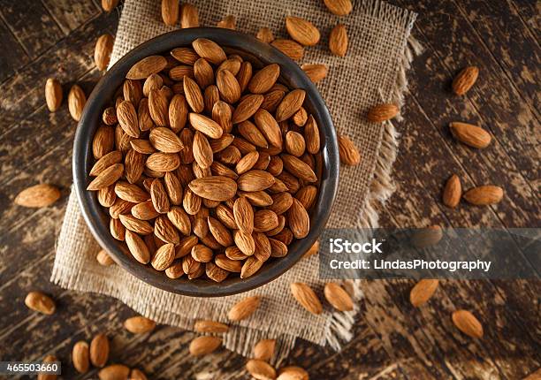Raw Organic Almonds Stock Photo - Download Image Now - Almond, Bowl, Raw Food