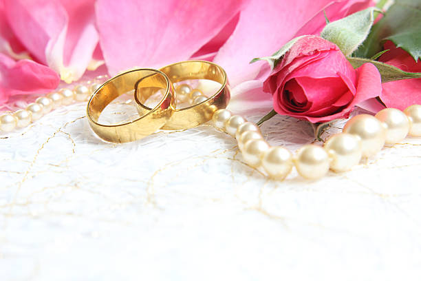 istock pair of wedding rings with roses for background image 465504788