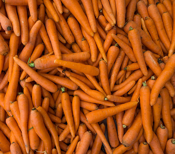 istock carrot background.   Raw fresh carrots close up. 465504962