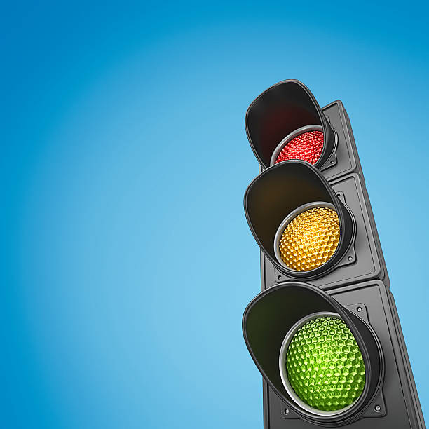 traffic lights closeup of traffic ligts on vignette background. stoplight stock pictures, royalty-free photos & images