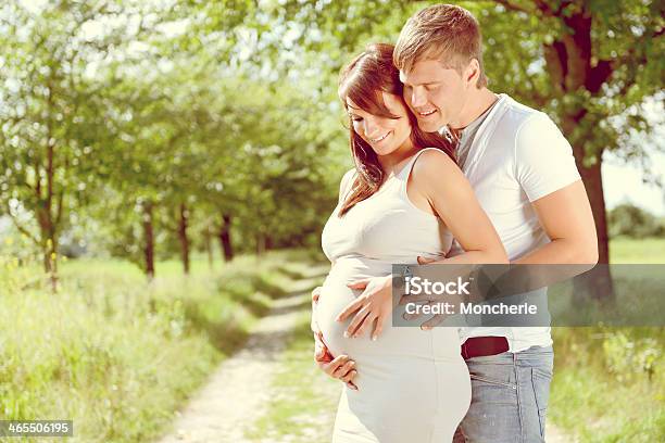 Pregnant Couple Outdoors Stock Photo - Download Image Now - 20-29 Years, Abdomen, Adult