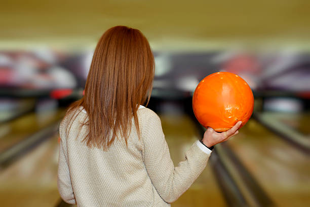 istock woman with bowling ball 465506343