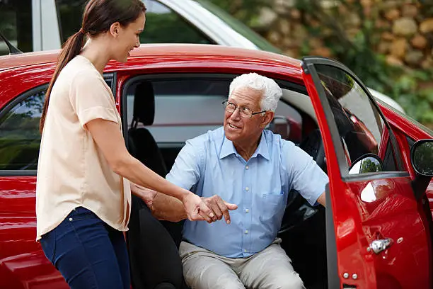 Photo of Let me help you out of the car